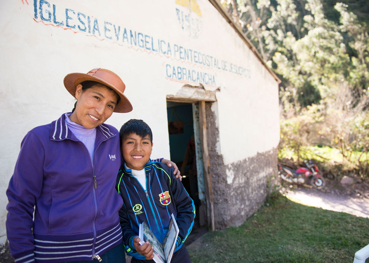 Woman and child outside church in Peru.